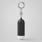 Alarma personal KÄRN negra con llavero y botón SOS, accesorio de seguridad para bolso, mochila o llaves