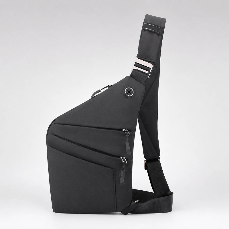 Mochila cruzada antirrobo Smart KÄRN negra en vista lateral, diseño compacto con varios compartimentos